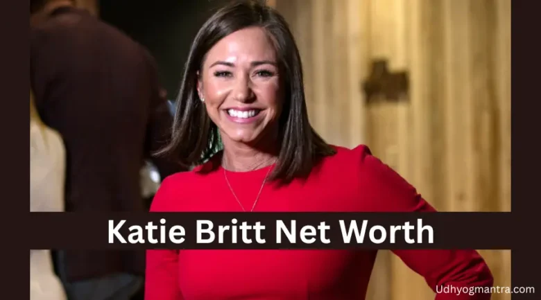 Katie Britt, U.S. Senator from Alabama, smiling confidently in a red dress, with the text "Katie Britt's Net Worth" displayed at the bottom.